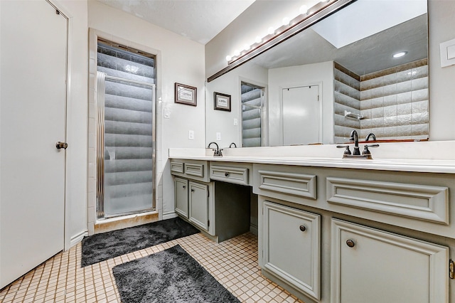 full bath featuring tile patterned flooring, double vanity, and a shower stall