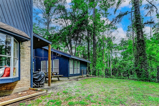view of yard featuring a patio and a fenced backyard