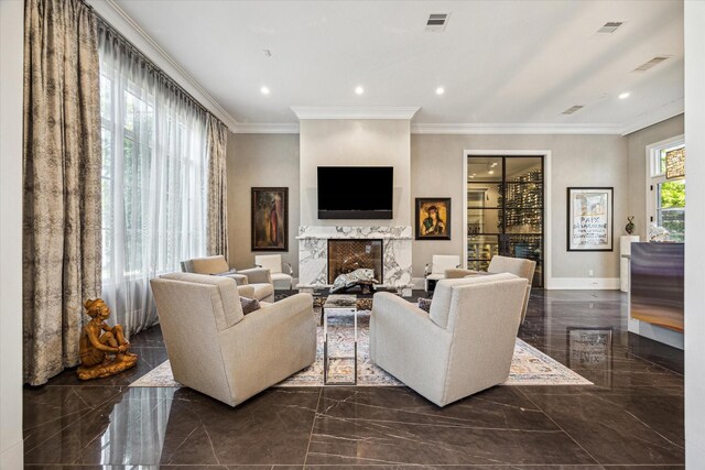 3851 Chevy Chase Dr, Houston, TX 77019 - living area featuring visible vents, a premium fireplace, crown molding, and marble finish floor