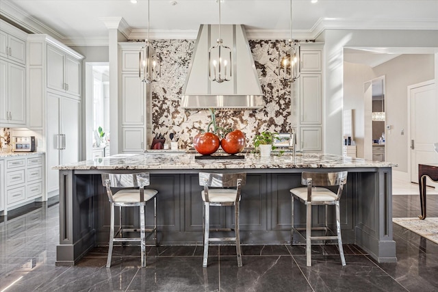 3851 Chevy Chase Dr, Houston, TX 77019 - kitchen with light stone counters, a spacious island, marble finish floor, and backsplash