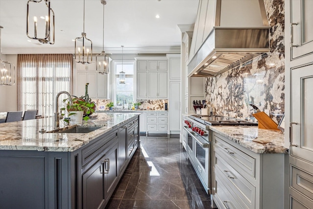 3851 Chevy Chase Dr, Houston, TX 77019 - kitchen featuring a sink, a chandelier, wall chimney exhaust hood, backsplash, and double oven range