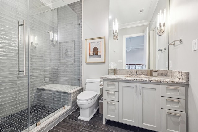 3851 Chevy Chase Dr, Houston, TX 77019 - bathroom with ceiling fan, a stall shower, toilet, ornamental molding, and vanity