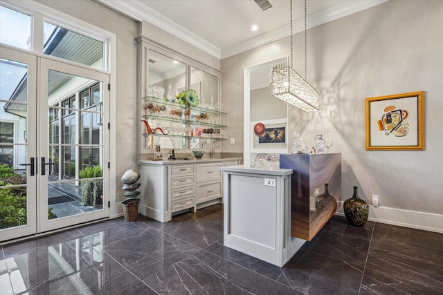 3851 Chevy Chase Dr, Houston, TX 77019 - bar featuring baseboards, ornamental molding, indoor wet bar, and marble finish floor