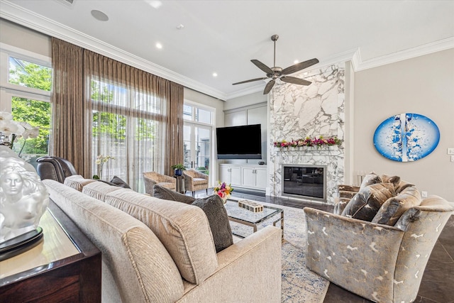 3851 Chevy Chase Dr, Houston, TX 77019 - living room featuring a high end fireplace, a ceiling fan, ornamental molding, and recessed lighting