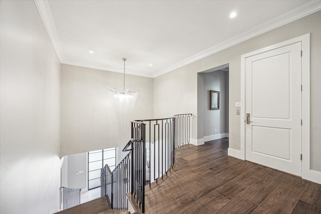 3851 Chevy Chase Dr, Houston, TX 77019 - hallway featuring an upstairs landing, a notable chandelier, baseboards, ornamental molding, and wood finished floors