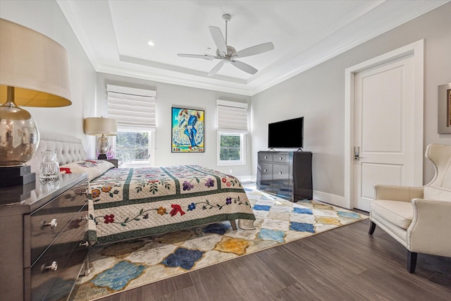 3851 Chevy Chase Dr, Houston, TX 77019 - bedroom with wood finished floors, a tray ceiling, ornamental molding, and a ceiling fan