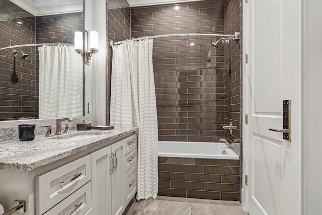 3851 Chevy Chase Dr, Houston, TX 77019 - bathroom featuring tiled shower / bath combo and vanity