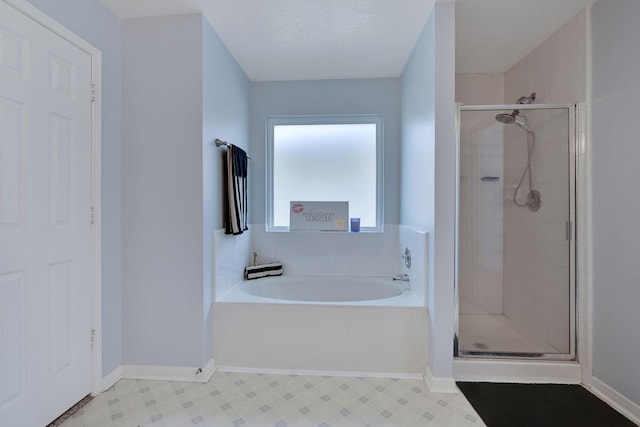 3739 Apple Hollow Ln, Humble, TX 77396 - full bathroom with a stall shower, a bath, tile patterned floors, and baseboards