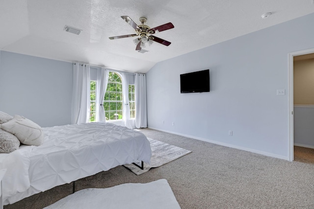 3739 Apple Hollow Ln, Humble, TX 77396 - bedroom featuring carpet flooring, lofted ceiling, a ceiling fan, baseboards, and a textured ceiling
