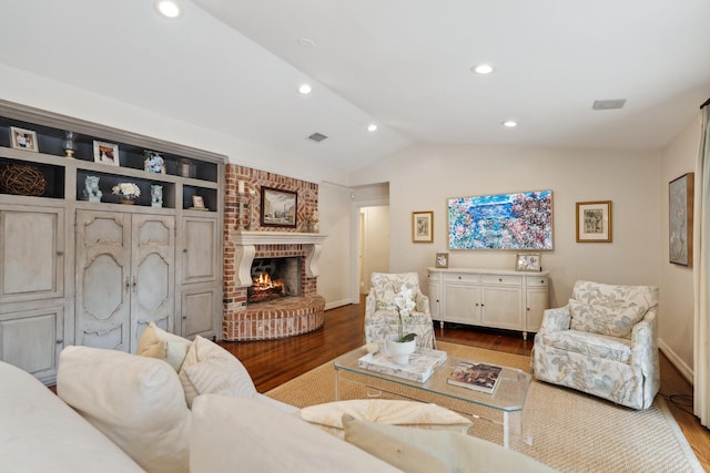 living room featuring baseboards, recessed lighting, wood finished floors, and vaulted ceiling