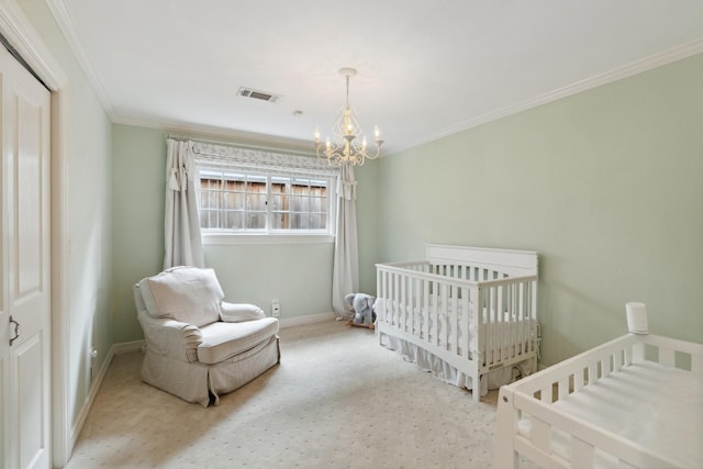 carpeted bedroom featuring visible vents, crown molding, a nursery area, baseboards, and an inviting chandelier