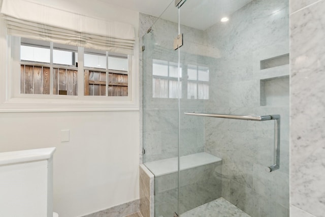 bathroom with a shower stall