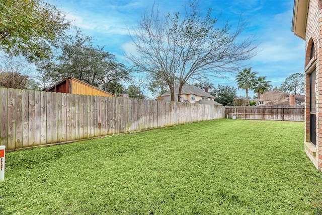 view of yard featuring a fenced backyard