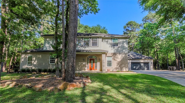 traditional-style house featuring a front yard, driveway, and brick siding