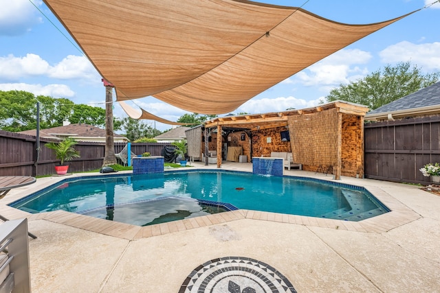 view of swimming pool with a pergola, a pool with connected hot tub, a fenced backyard, and a patio area