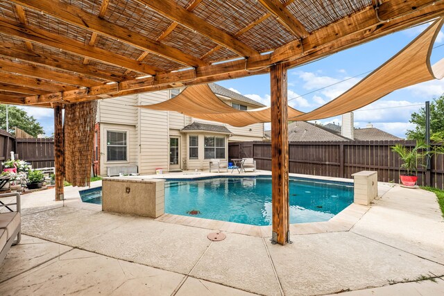 view of swimming pool featuring a fenced in pool, a fenced backyard, and a patio area