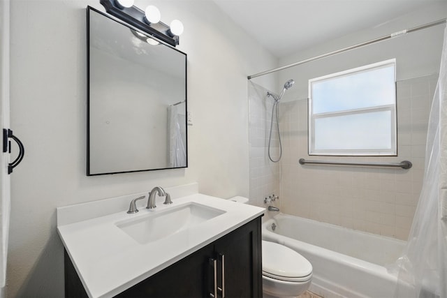 bathroom featuring toilet, shower / bath combo, and vanity