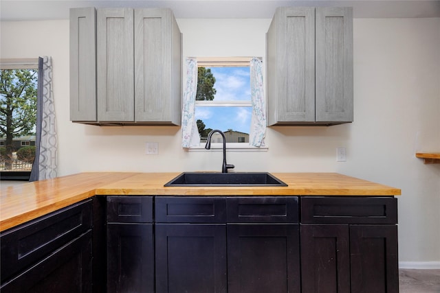 kitchen featuring a sink and butcher block counters