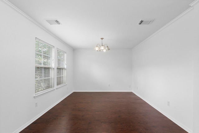 empty room with visible vents, a chandelier, and dark wood-type flooring