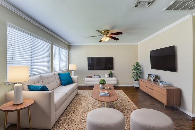 living area featuring dark wood-style floors, baseboards, and ornamental molding