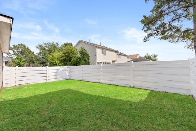 view of yard featuring a fenced backyard