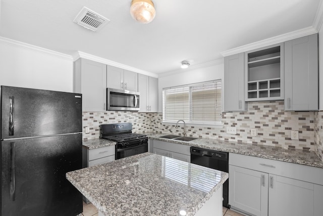 kitchen featuring open shelves, black appliances, a sink, gray cabinetry, and visible vents