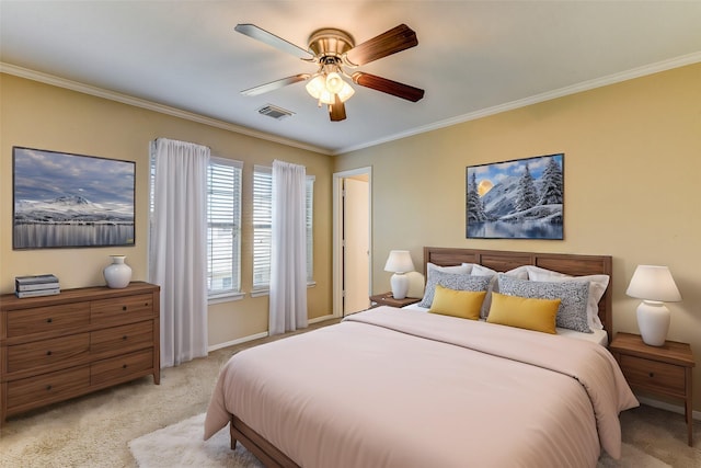 bedroom featuring crown molding, a ceiling fan, visible vents, baseboards, and light colored carpet