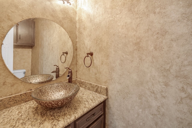 half bathroom with vanity