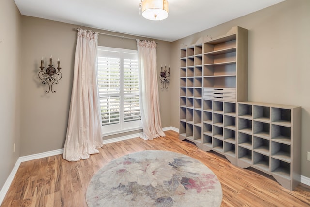 interior space featuring wood finished floors and baseboards
