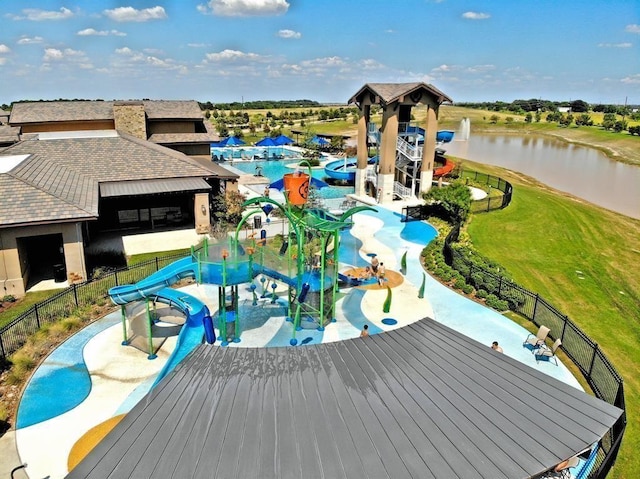 30106 Reagans Ranch Dr, Katy, TX 77494 - community pool featuring a water play area, fence, a water view, and a yard
