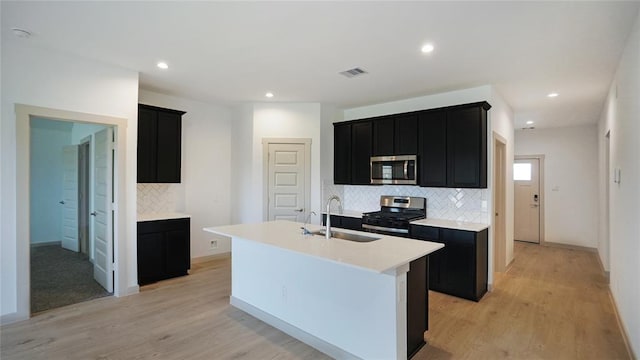 30106 Reagans Ranch Dr, Katy, TX 77494 - kitchen featuring a sink, dark cabinets, and stainless steel appliances