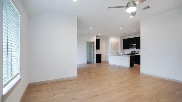 30106 Reagans Ranch Dr, Katy, TX 77494 - unfurnished living room with visible vents, recessed lighting, ceiling fan, and light wood-style flooring
