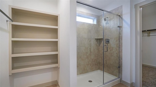 30106 Reagans Ranch Dr, Katy, TX 77494 - full bath featuring baseboards, a spacious closet, and a stall shower