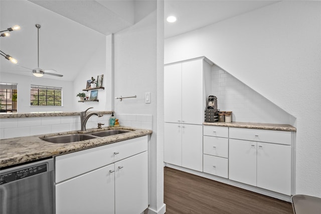 kitchen with white cabinetry, dark wood-type flooring, a sink, and dishwasher