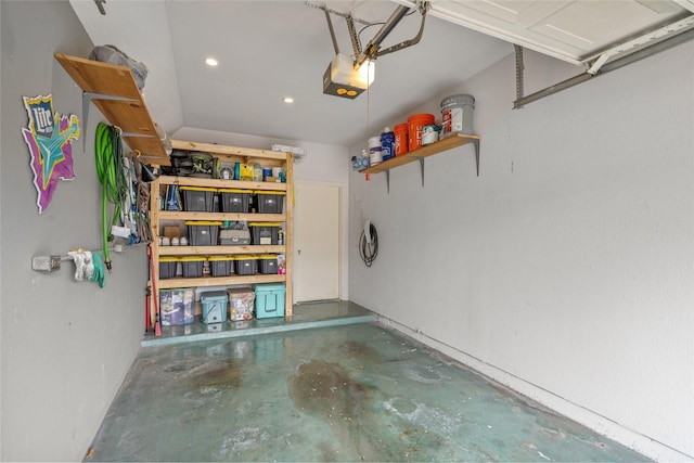 garage with recessed lighting and a garage door opener