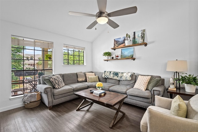 living area with vaulted ceiling, baseboards, dark wood-type flooring, and a ceiling fan