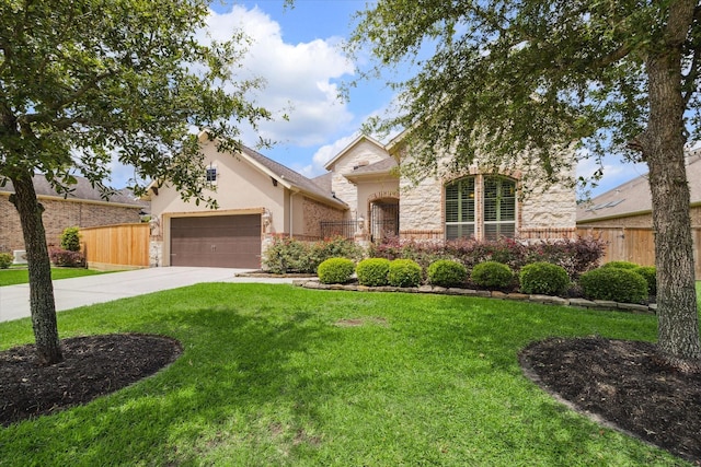 19907 Cullen Ridge Dr, Porter, TX 77365 - view of front facade with fence, concrete driveway, and stone siding