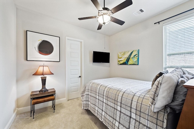 19907 Cullen Ridge Dr, Porter, TX 77365 - bedroom with light colored carpet, visible vents, a ceiling fan, and baseboards