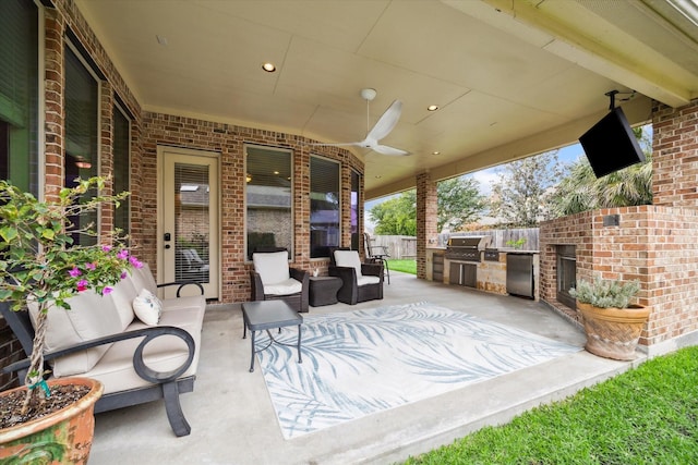 19907 Cullen Ridge Dr, Porter, TX 77365 - view of patio featuring fence, exterior kitchen, and grilling area