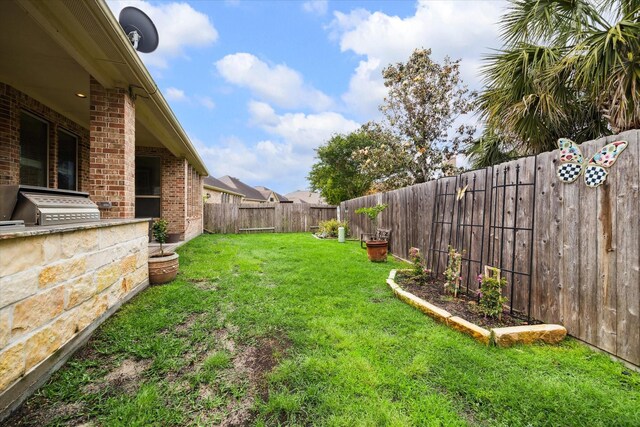 19907 Cullen Ridge Dr, Porter, TX 77365 - view of yard featuring exterior kitchen and a fenced backyard
