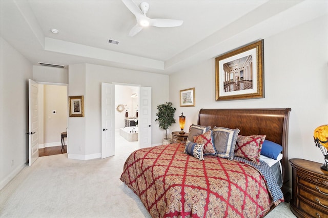 19907 Cullen Ridge Dr, Porter, TX 77365 - bedroom with carpet, visible vents, a tray ceiling, and baseboards