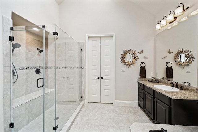 19907 Cullen Ridge Dr, Porter, TX 77365 - full bath with lofted ceiling, vanity, a stall shower, and baseboards