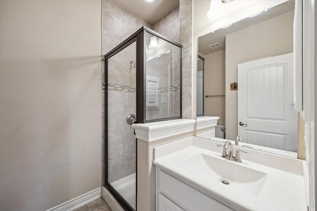 full bath with visible vents, a stall shower, and vanity