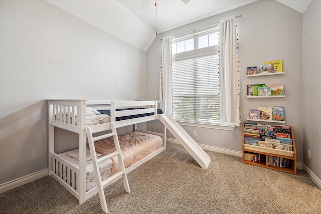bedroom with baseboards, carpet, and lofted ceiling