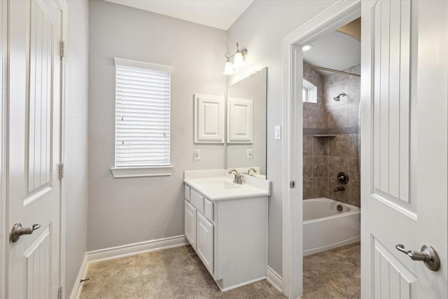 full bath featuring baseboards,  shower combination, vanity, and plenty of natural light