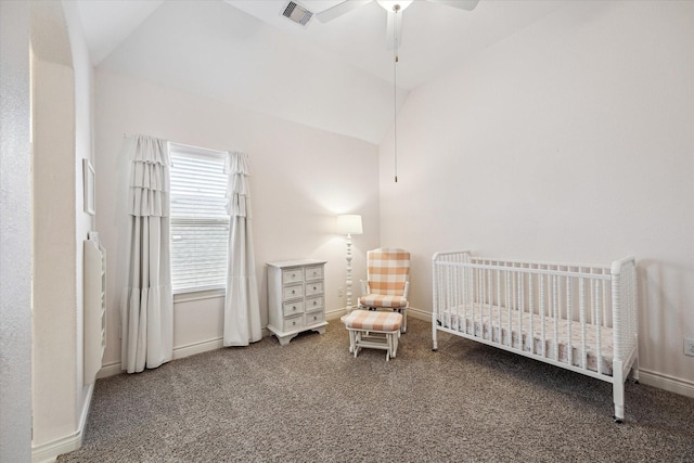 bedroom featuring a nursery area, carpet, vaulted ceiling, baseboards, and visible vents
