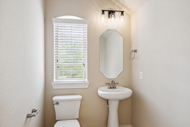 bathroom featuring toilet