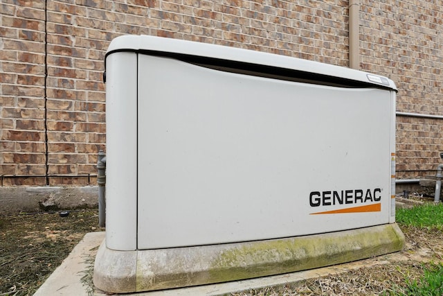 exterior details with brick siding and a power unit