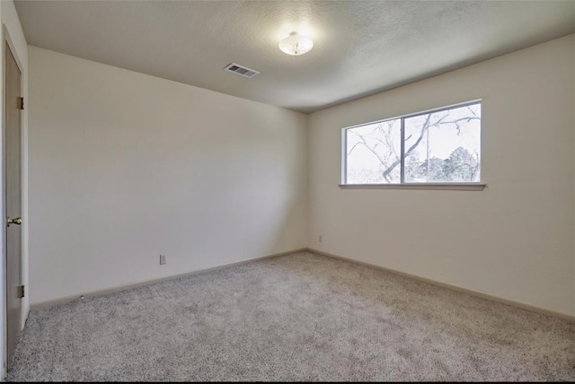215 N Howard St, Tomball, TX 77375 - empty room with carpet and baseboards
