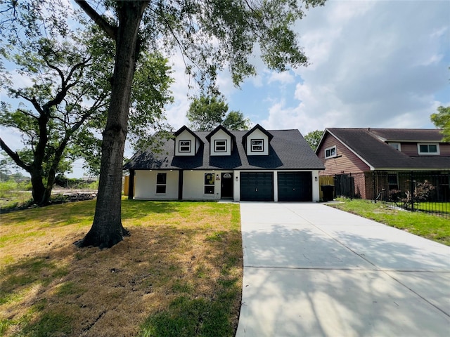 5618 Grace Point Ln, Houston, TX 77048 - cape cod-style house featuring a garage, fence, a front lawn, and driveway